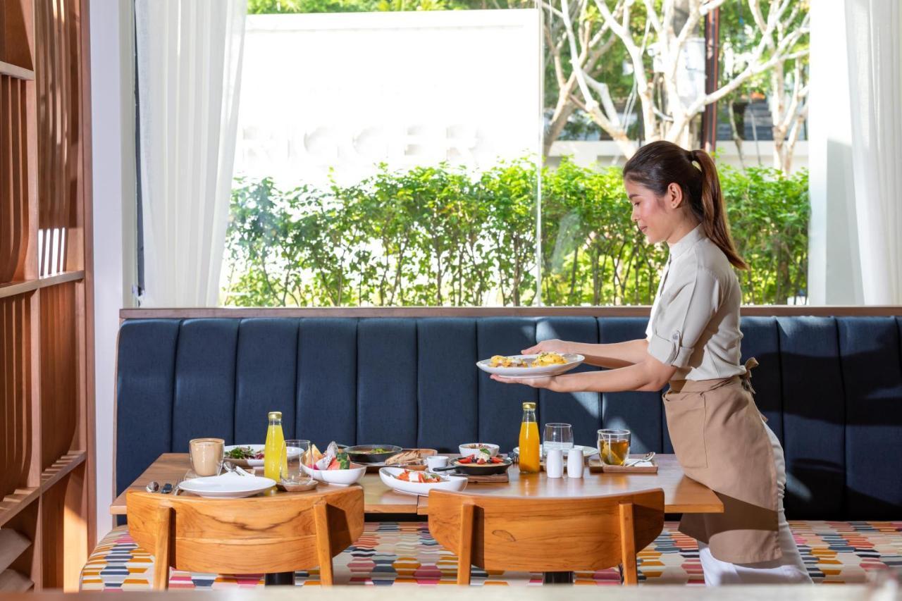 Outrigger Surin Beach Resort - Sha Extra Plus Praia de Surin Exterior foto A Thai waitress serving food