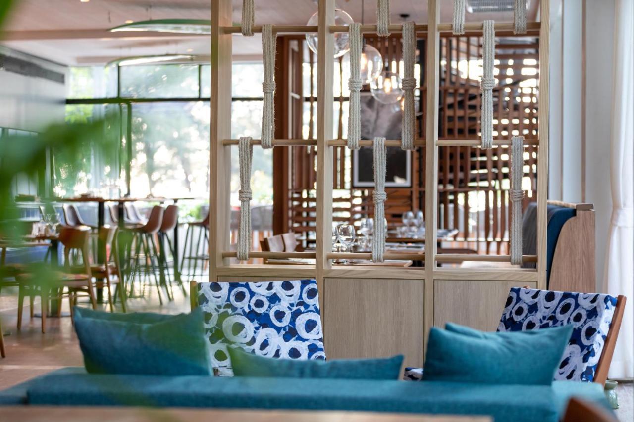 Outrigger Surin Beach Resort - Sha Extra Plus Praia de Surin Exterior foto The restaurant