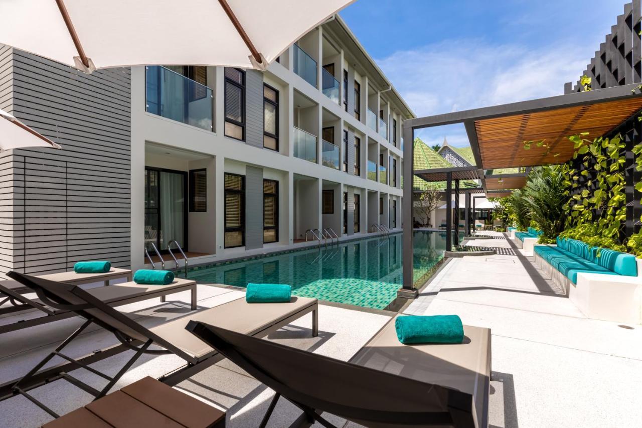 Outrigger Surin Beach Resort - Sha Extra Plus Praia de Surin Exterior foto The swimming pool at the hotel